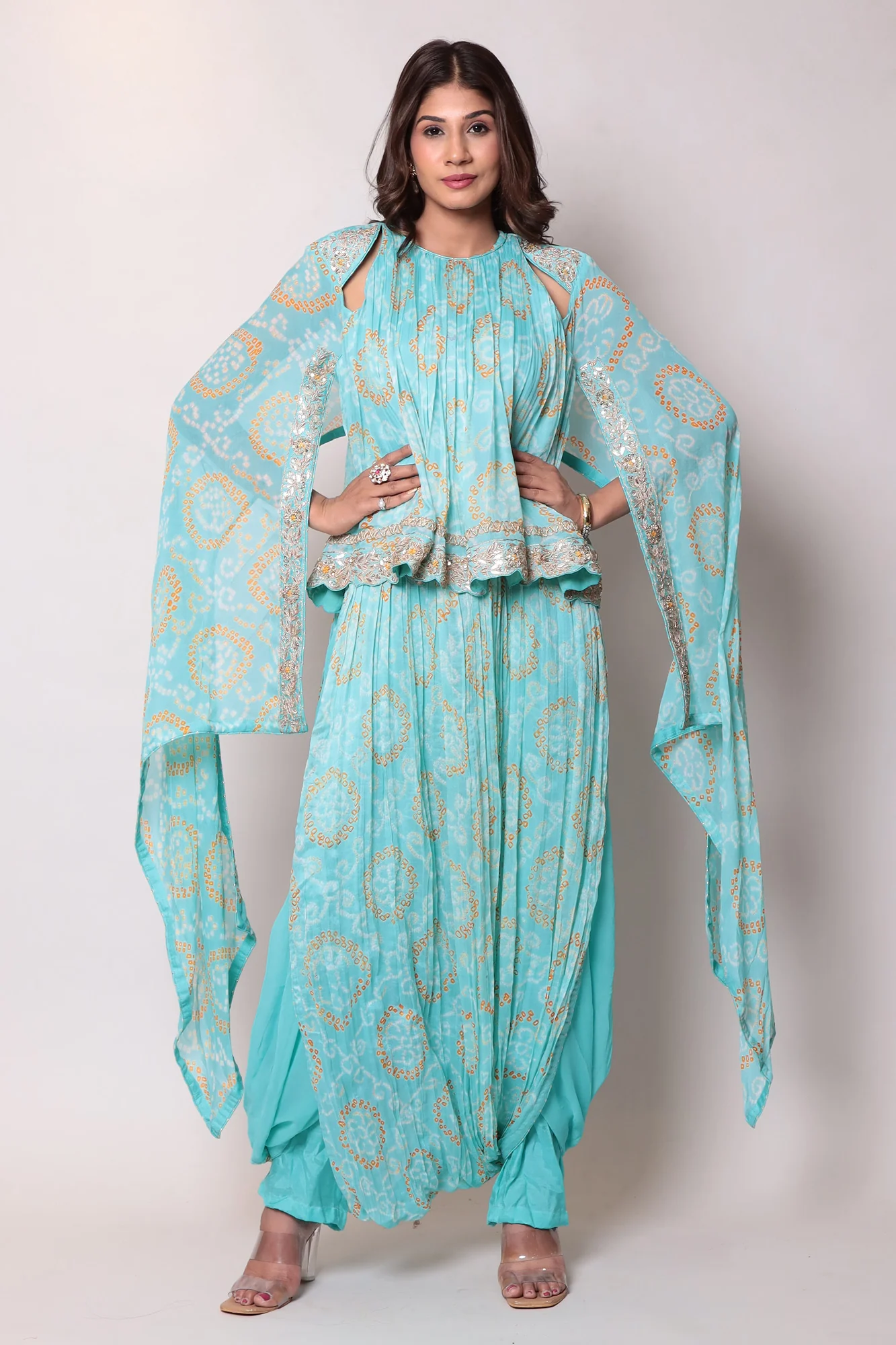 Georgette Bandhej Dhoti style jumpsuit with extended sleeves and peek-a-boo at shoulders.