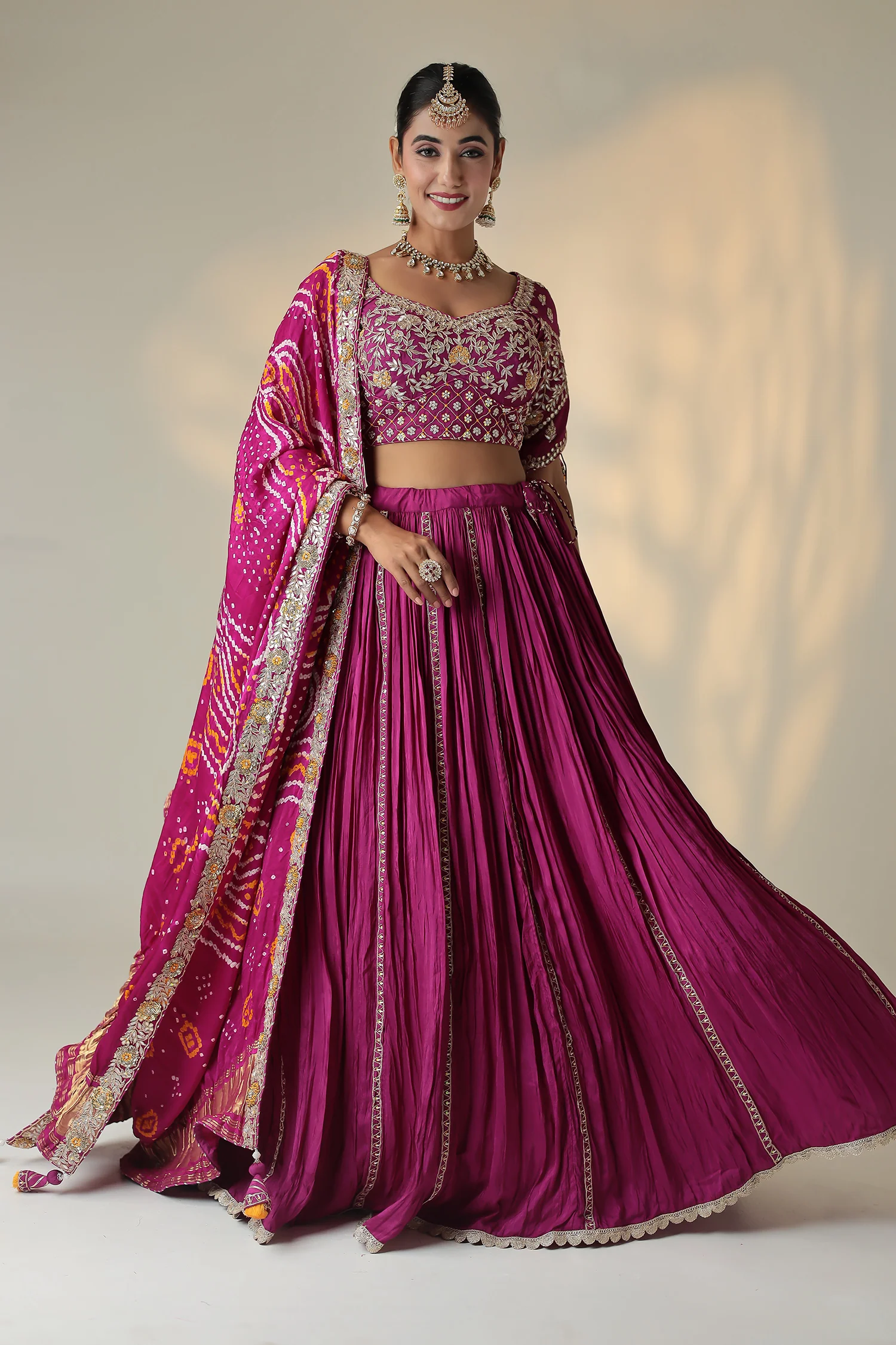 Bandhej Silk Lehenga Embellished with Gota Patti, Thread and Zardozi work.
